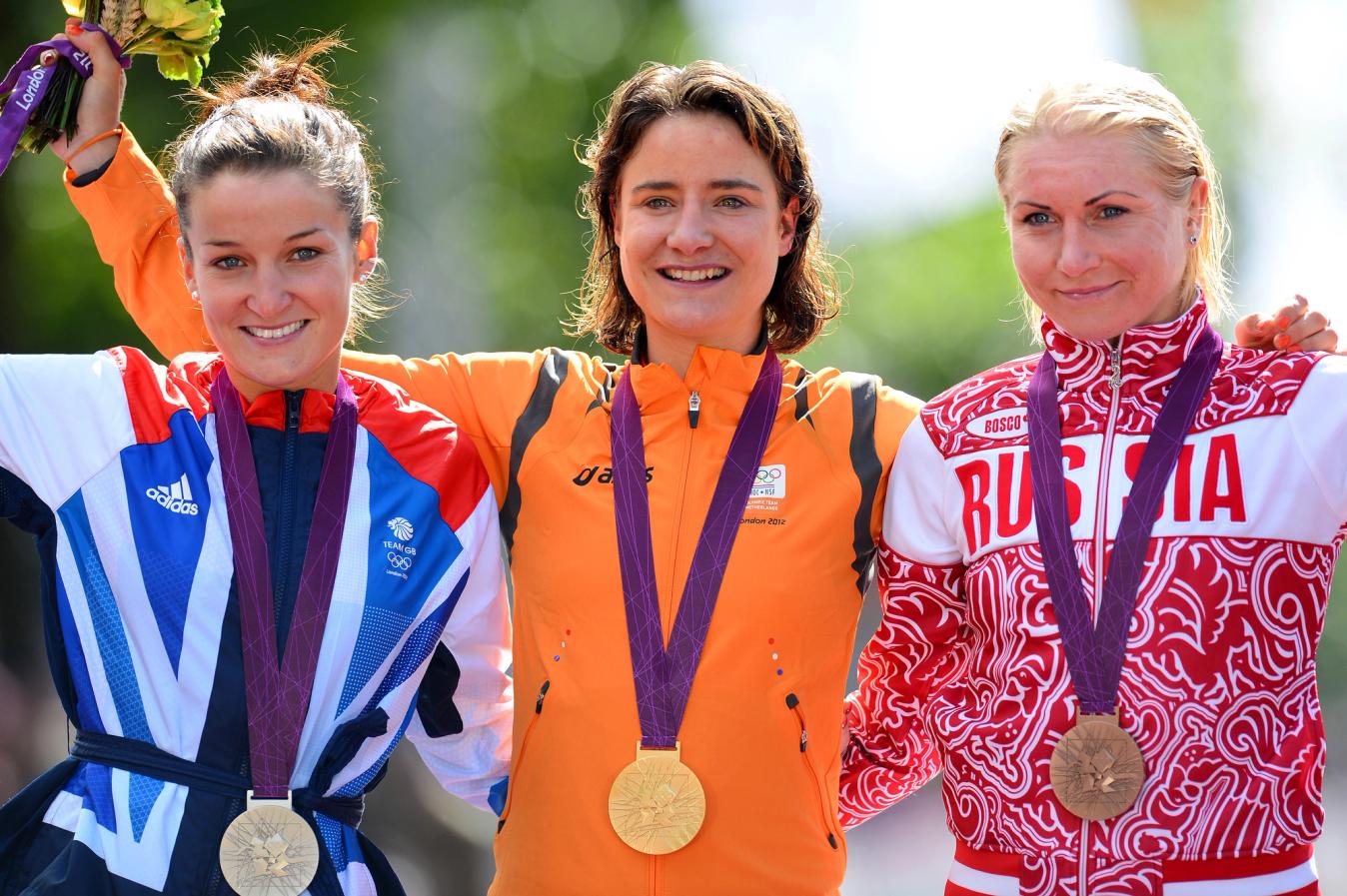 Lizzie Deignan - then Armitstead - with the silver medal (left) after the London 2012 Olympic road race