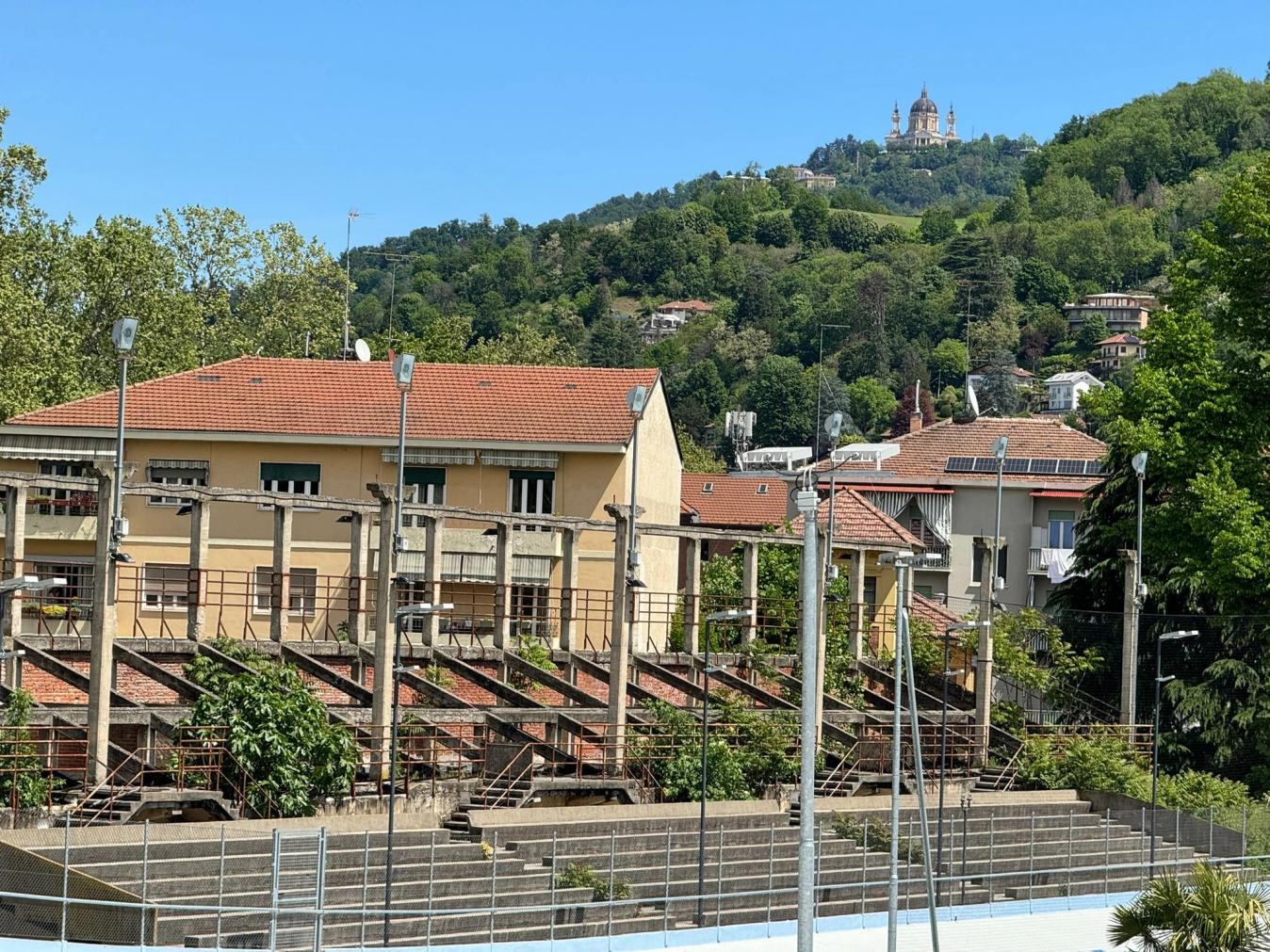 The Superga Basilica overlooks the track, where the remnants of the old tribunes will soon be renewed with more sporting projects