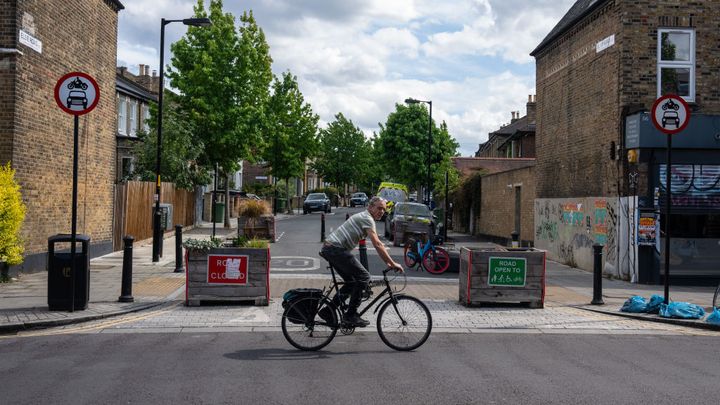 A cyclists passes a low traffic neighbourhood in the UK