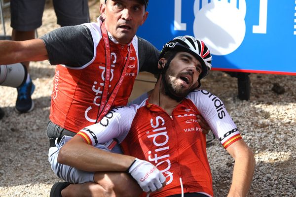 Jesús Herrada is tended to by Cofidis soigneur Raul Matias, once he'd wriggled free from the police