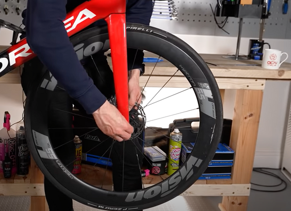 a wheel being removed from the bike