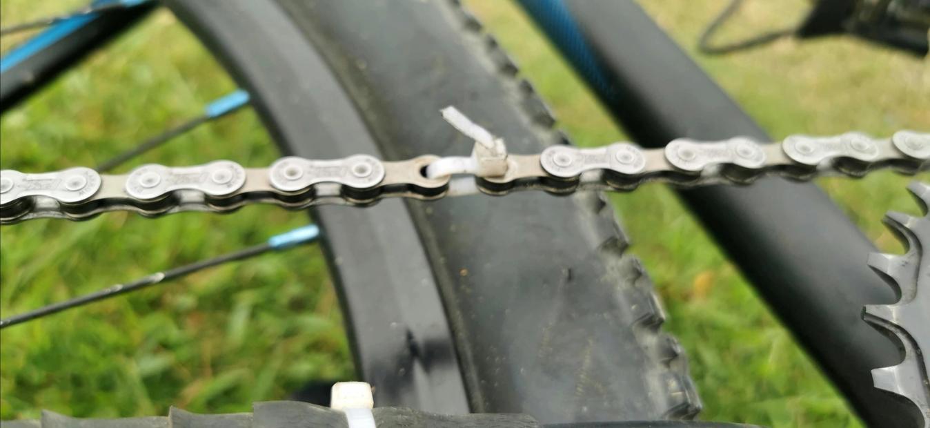 A zip tie used to fixed a missing chain link