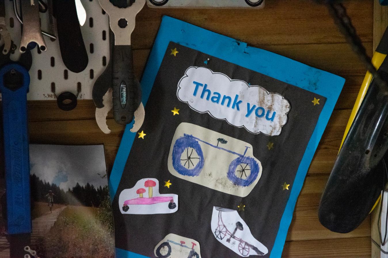 A thank you card pinned up in Mike Jones' workshop