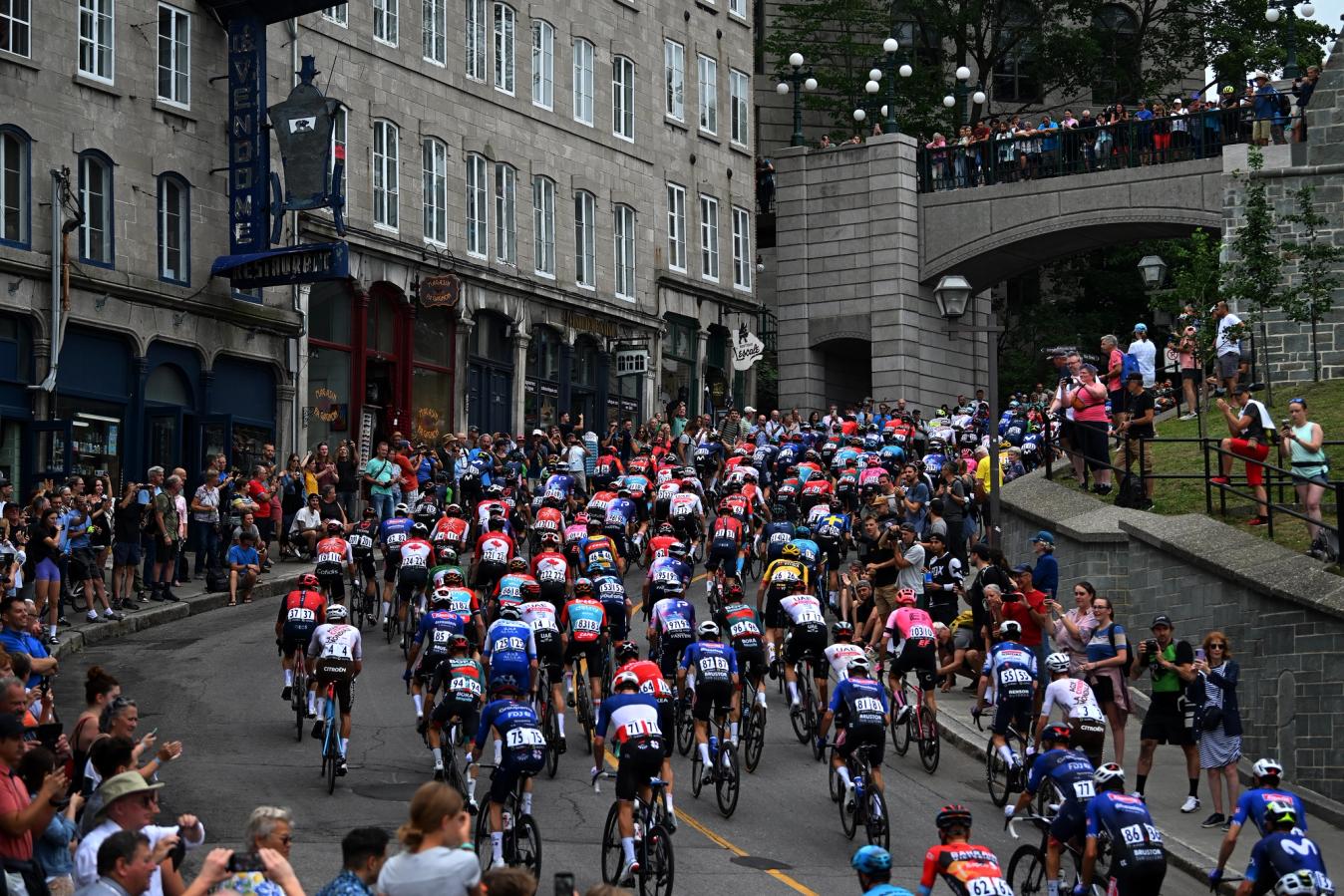 The peloton ascending the steep ramp up from the Saint Lawrence river in Quebec City