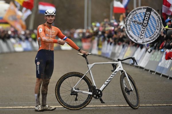 Mathieu van der Poel pointing to the Canyon bike that helped him to the cyclo-cross world title earlier this 