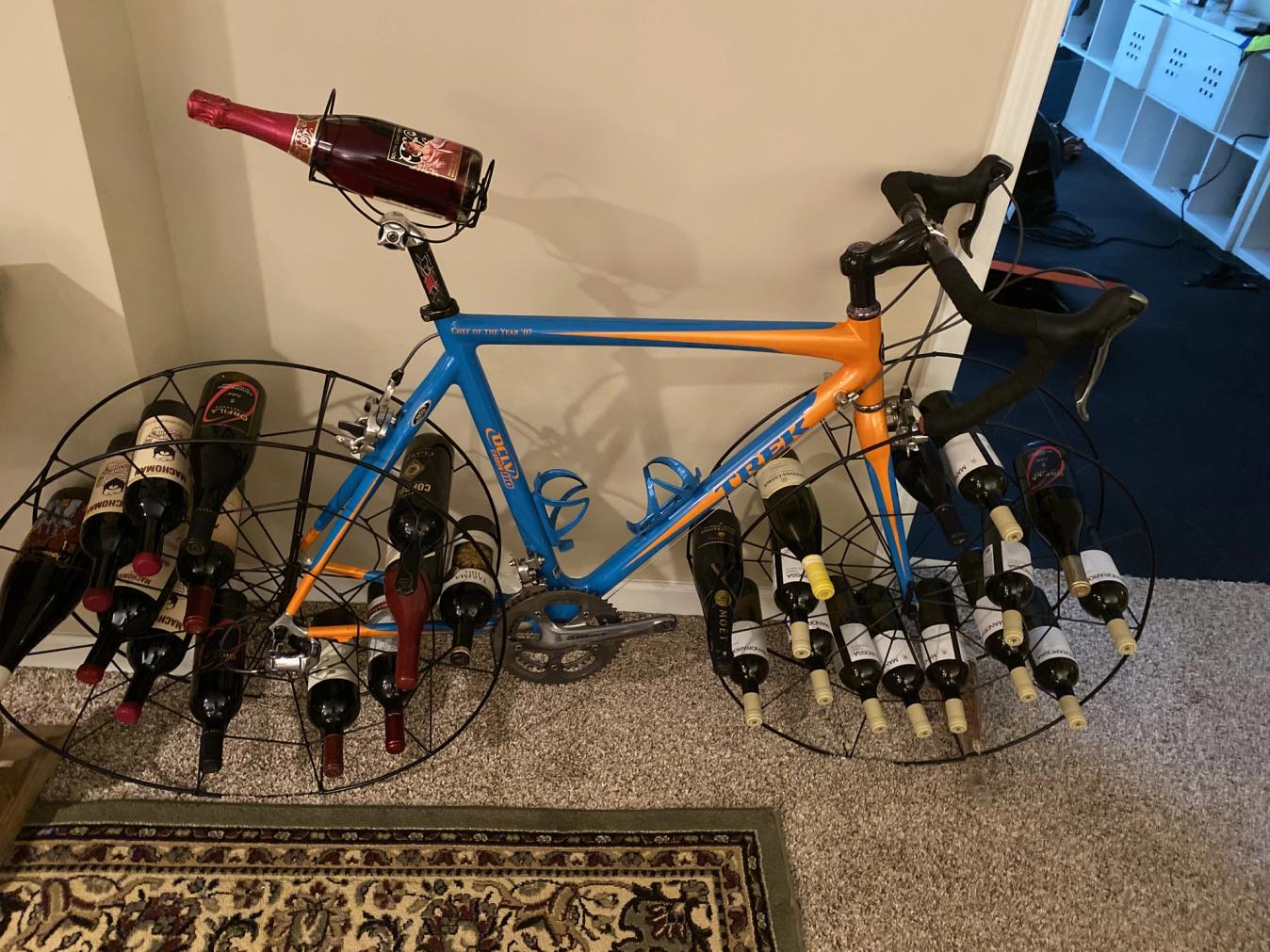 Trek bicycle turned into a wine rack with lots of wine bottle storage
