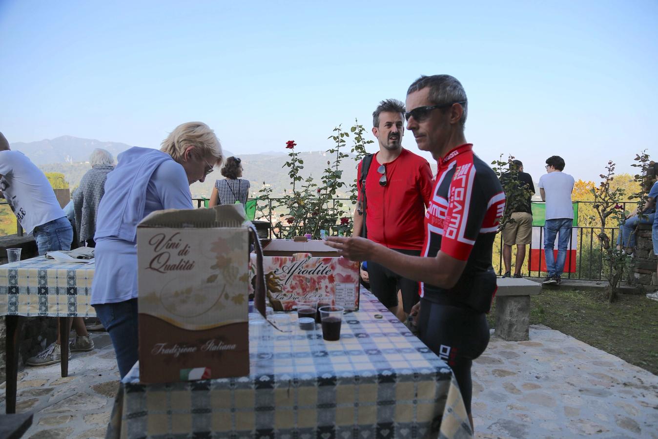 Red wine being served to supporters at the community centre overlooking La Boccola.