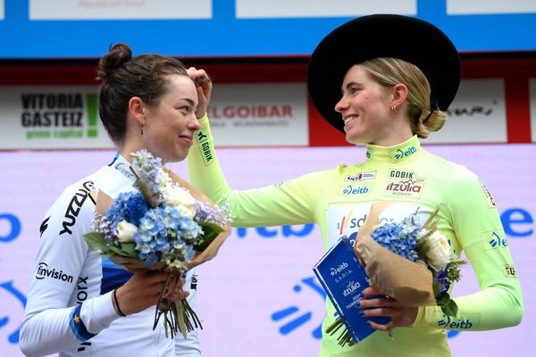 Demi Vollering (right) with Mischa Bredewold on the podium at Itzulia, where between them they won all the stages