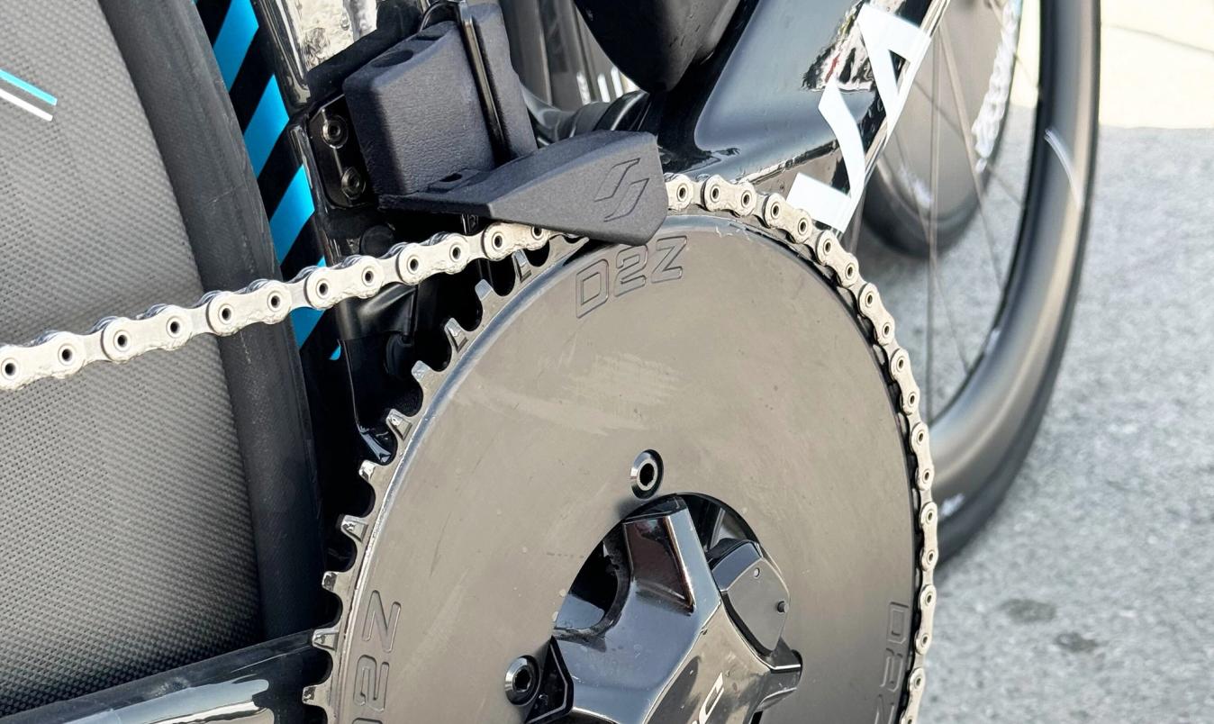 Running a 1x set-up means removing the front derailleur. Most teams substitute it with a chain guide which helps to keep the chain on the ring. Decathlon-AG2R La Mondiale had an aero solution for their Van Rysel bikes in the form of the the Drag2Zero Aero chain catcher