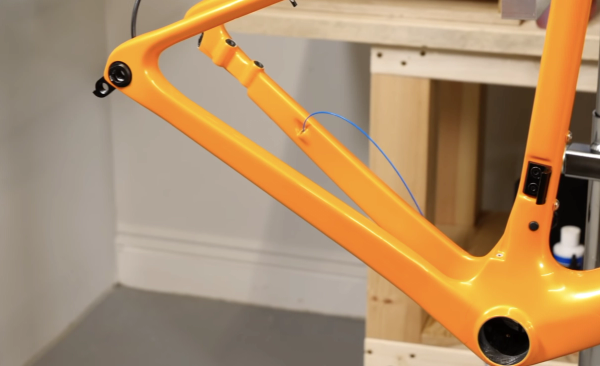 Use a routing kit to guide the hoses through the frame