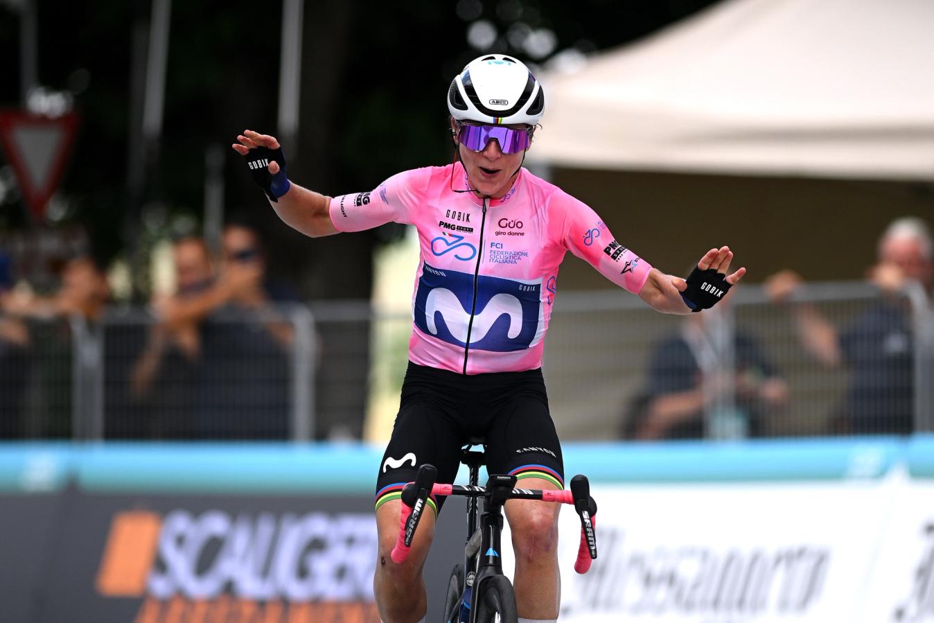 Van Vleuten celebrates another stage win as she strengthens her grip on the pink jersey