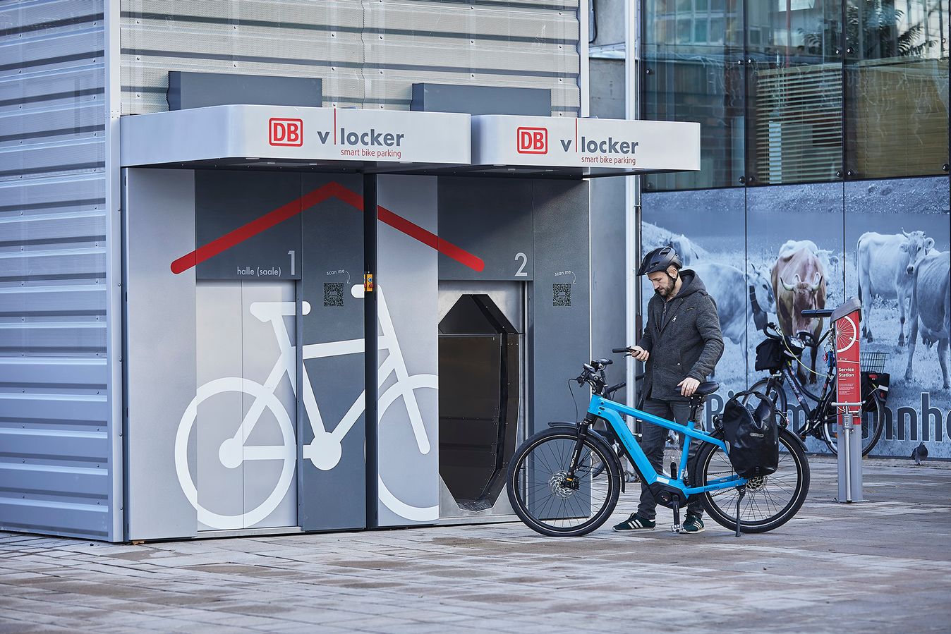 A cyclist stores his bike in a V-Locker