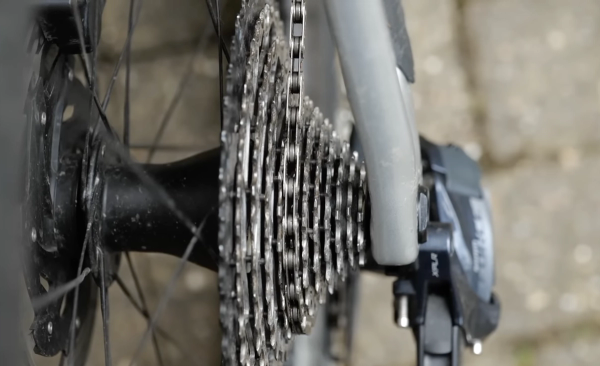 Change into the large chainring and middle of the cassette