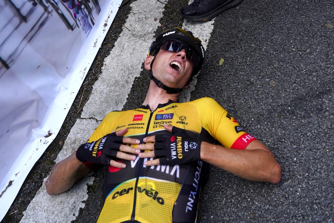 Delighted but exhausted, Milan Vader recovered on the ground after the line, before being helped to his feet by Jumbo-Visma teammate Steven Kruijswijk