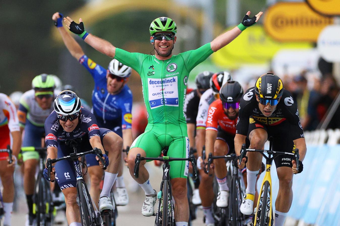 As Michael Mørkøv celebrates in the background, Mark Cavendish basks in the acclaim of winning stage 10 at the 2021 Tour de France