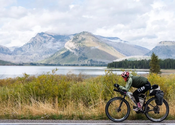 Lachlan Morton riding through the massive landscapes of the American West