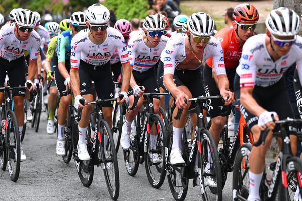 Tadej Pogačar surrounded by his teammates at the Giro d'Italia