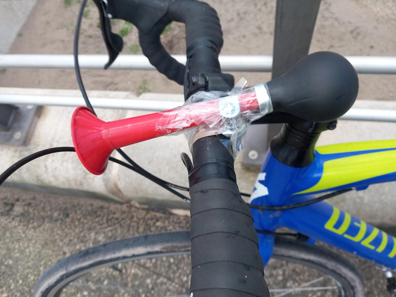 horn sellotaped to bike's handlebars