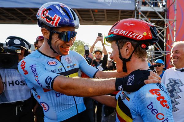 Wout van Aert and Remco Evenepoel celebrate the latter's World Championship Road Race title in 2022