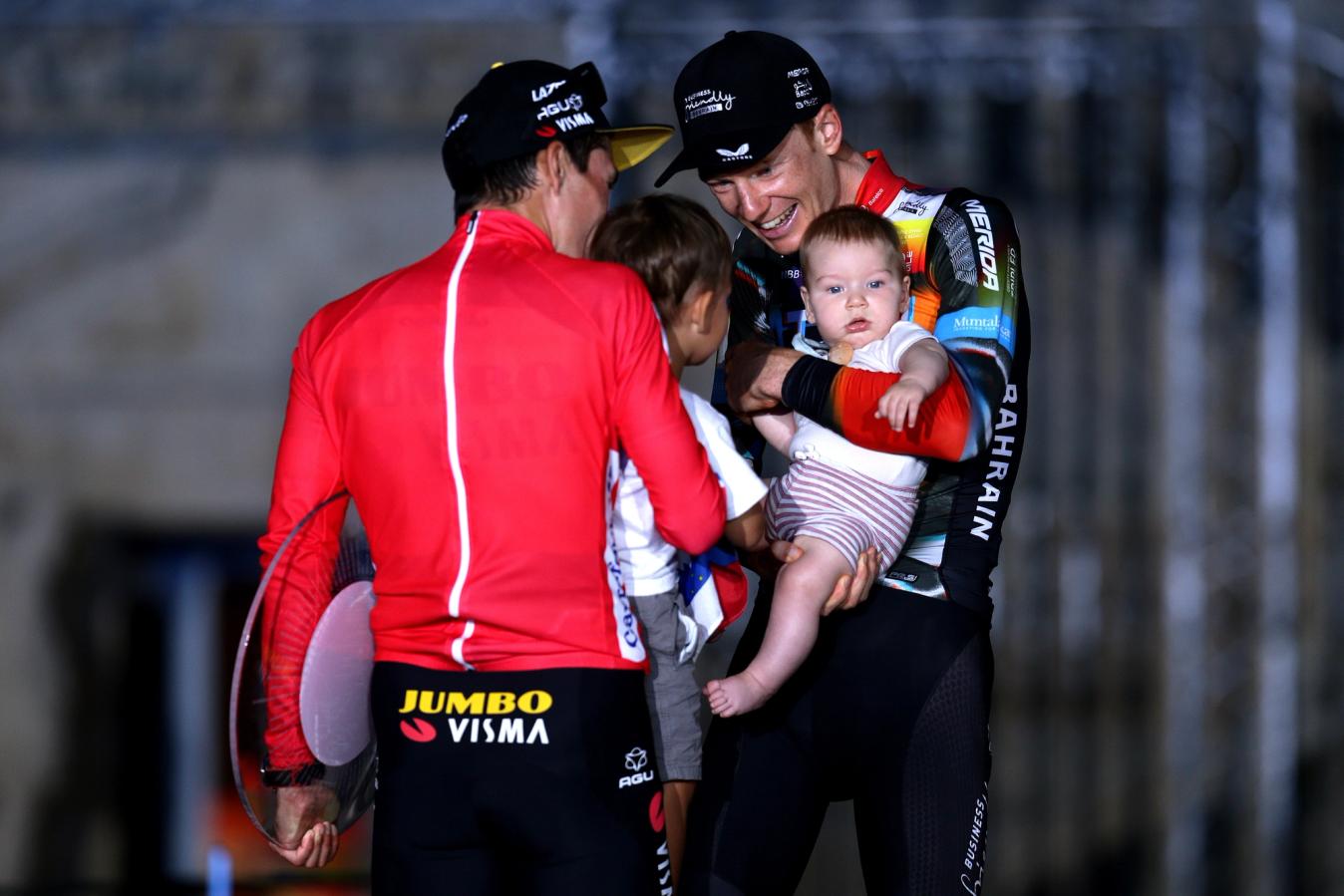 Haig and his son on the Podium of the 2021 Vuelta a España with Primož Roglič and his son