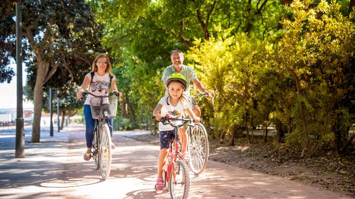 A family of three cycling in Spain