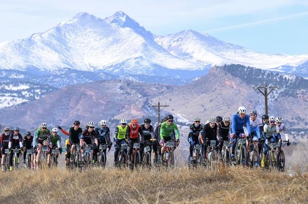 The Old Man Winter peloton in front of the 14,259 foot summit of Long's Peak