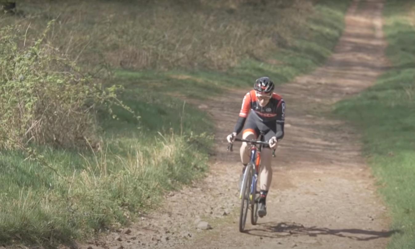 Staying seated with your chest close to the bar with a smooth pedal stroke is the most effective way to climb on gravel