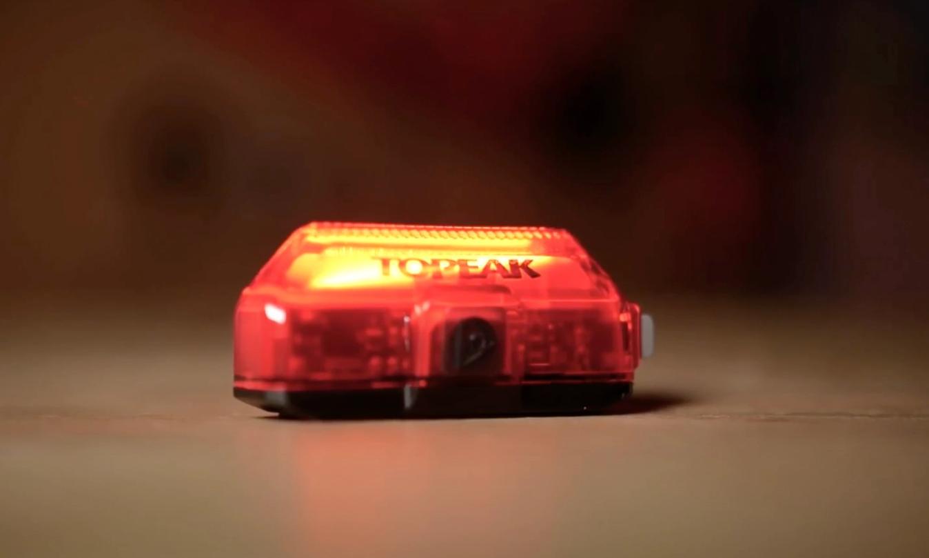 A rechargeable rear light is going to be the most cost effective solution 