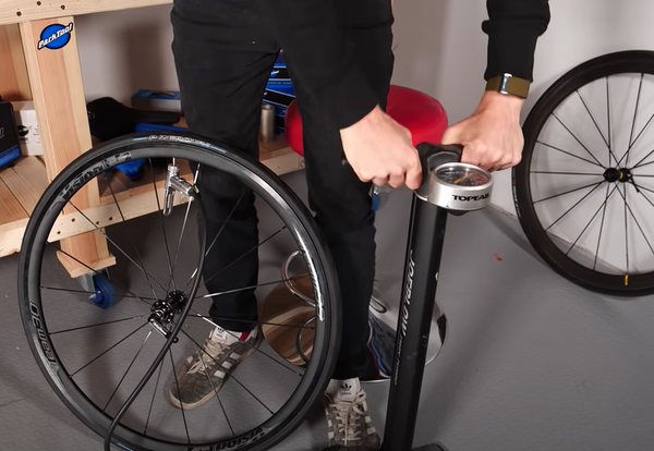 Inflating a tyre with a track pump
