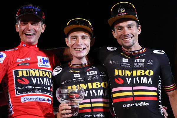 Sepp Kuss (left), Jonas Vingegaard (centre) and Primož Roglič (right) celebrate their podium success at the Vuelta a España