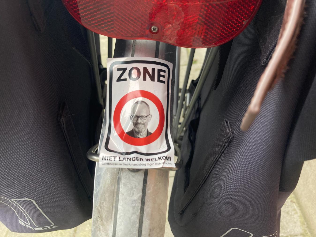 Not longer welcome: a sticker on a bicycle in Gent
