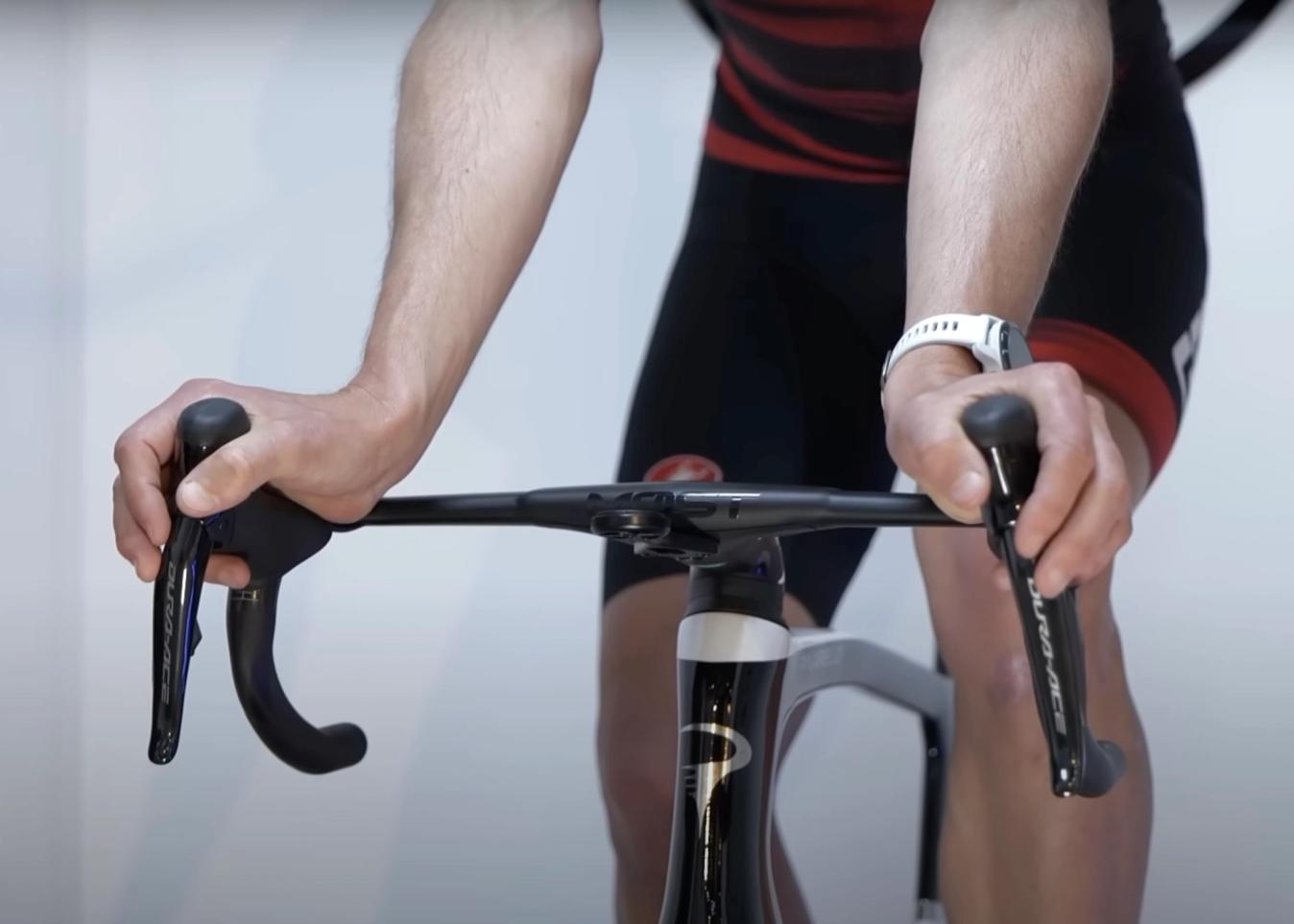 Rolling your wrists is a clear tell that the handlebars are too wide for a comfortable position.
