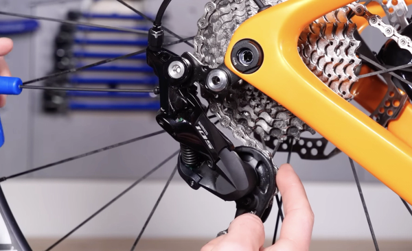 The B-tension screw adjusts the angle of the derailleur
