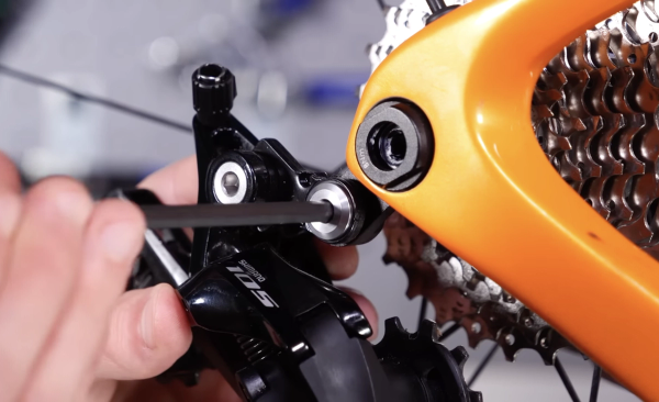 Unscrew the bolt and remove the old derailleur