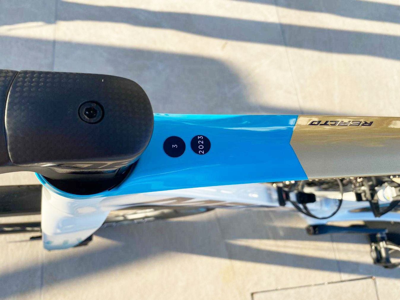The gold and blue design on the top tube