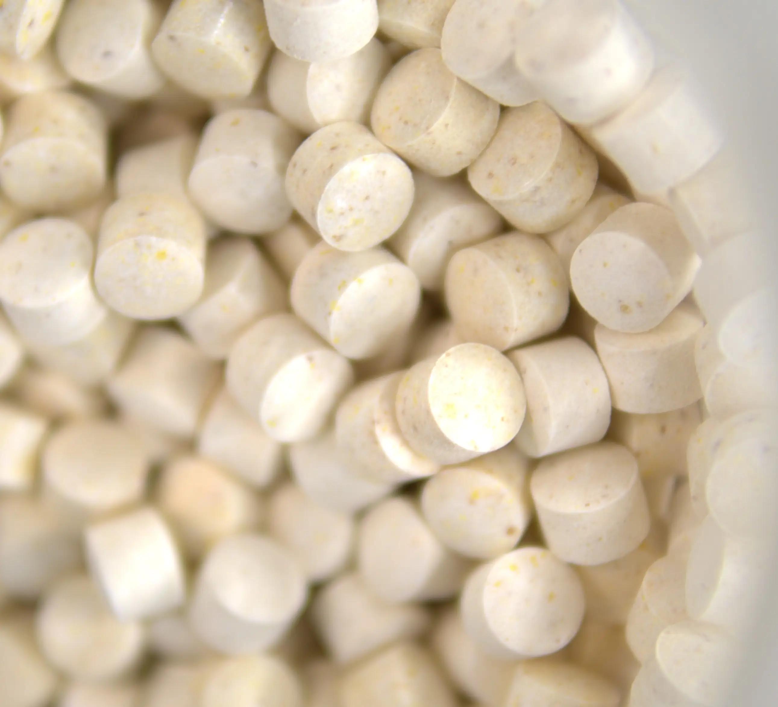 A close up of light coloured chewable tablets