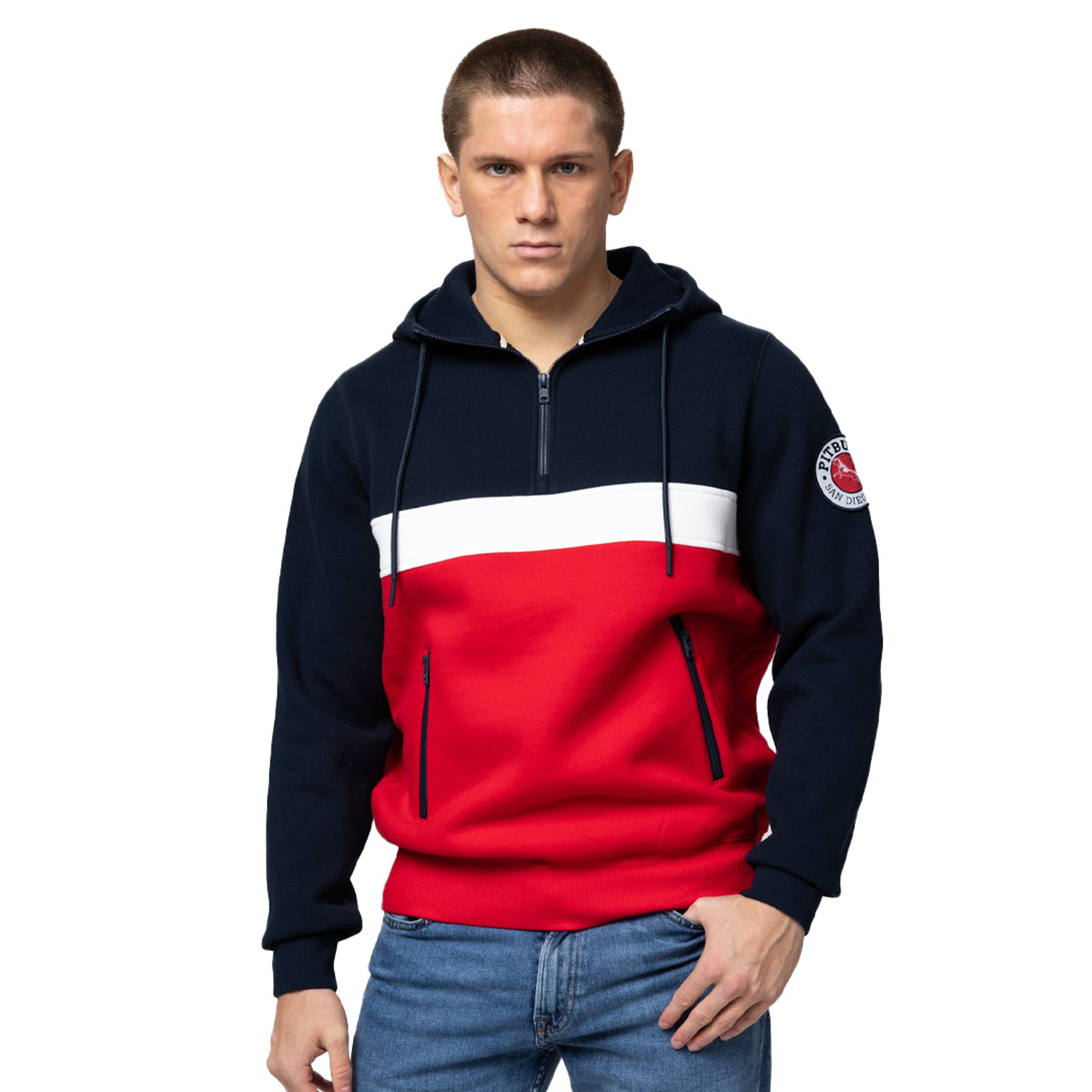 Man in navy and red color-block quarter-zip hoodie