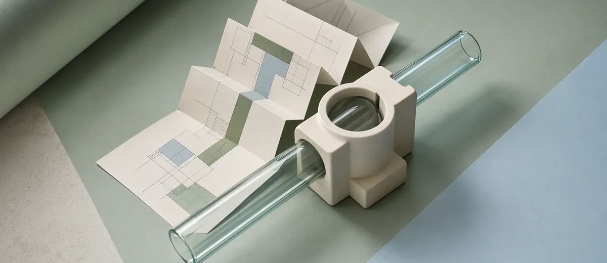 Paper, glass, and ceramic forms representing three integration layers.