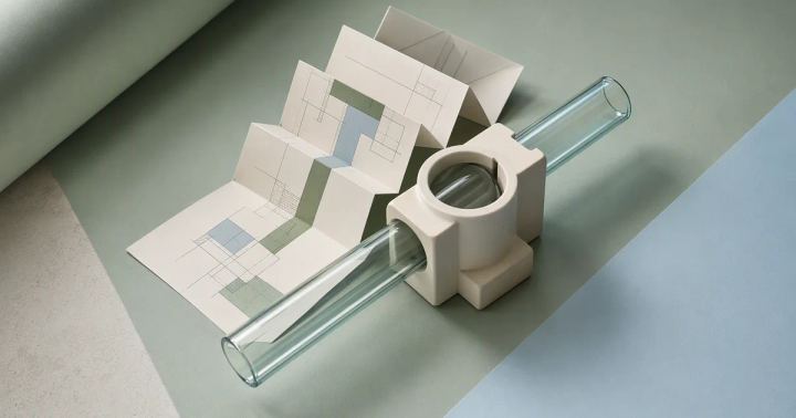 Paper, glass, and ceramic forms representing three integration layers.