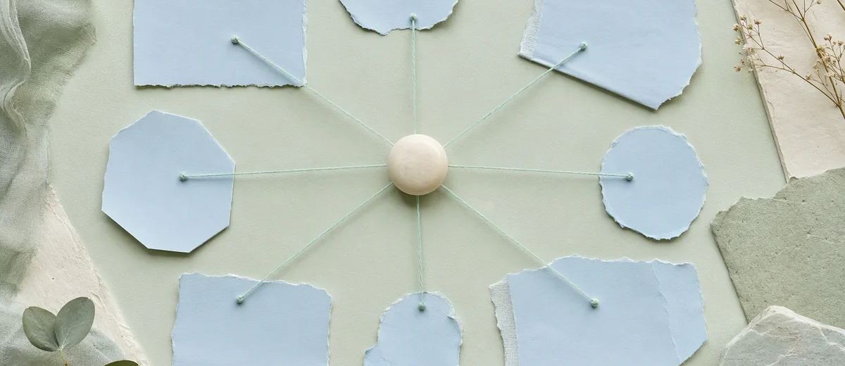 Mint threads connecting a single ivory source object to several pale blue paper forms, arranged as a calm physical evidence map