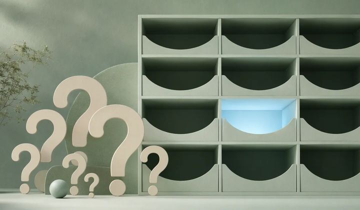 A set of ivory question-shaped abstract cutouts beside a mint filing grid with one empty compartment highlighted by pale blue light
