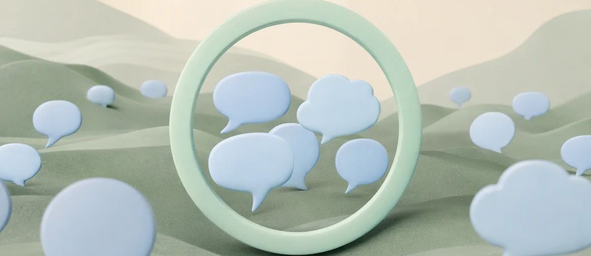 A small cluster of pale blue speech forms gathered through a mint circular frame, with many distant shapes remaining outside the frame