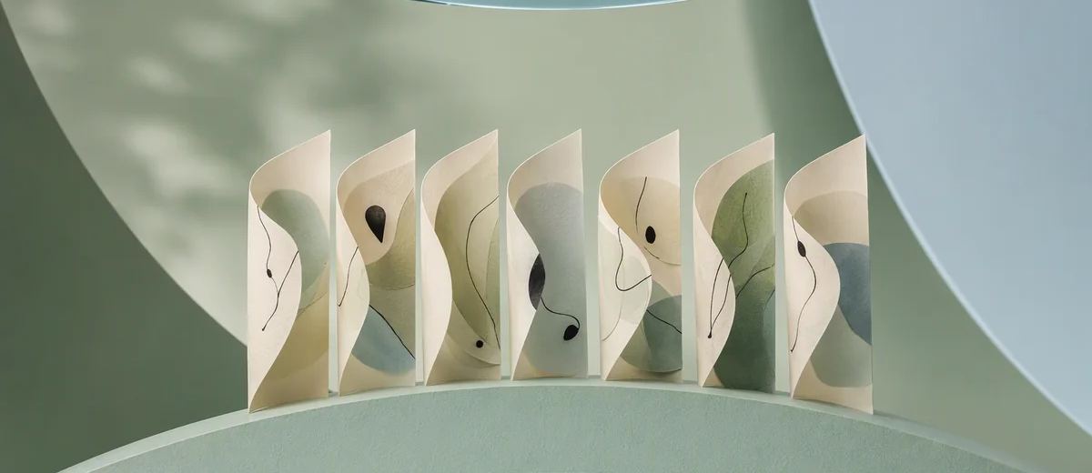 Seven curved ivory paper panels stand along a mint arc, with an overhead blue glass lens revealing their layered structure.