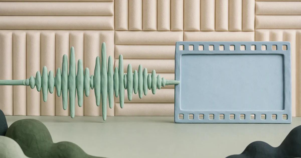 A mint audio waveform made from sculpted clay ends at a pale blue blank film frame with ivory soundproof fabric behind it.