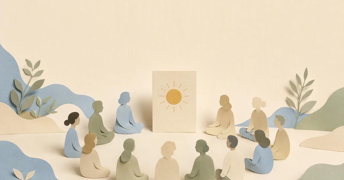 Paper figures sit in a circle around a standing card with a sun symbol.