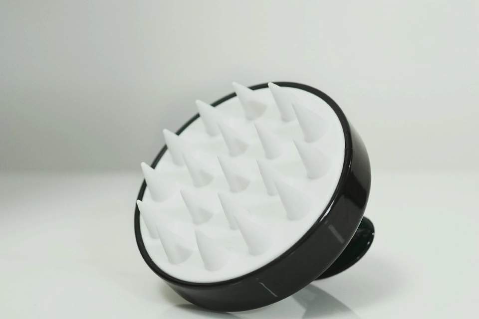 Black and white silicone scalp massager brush