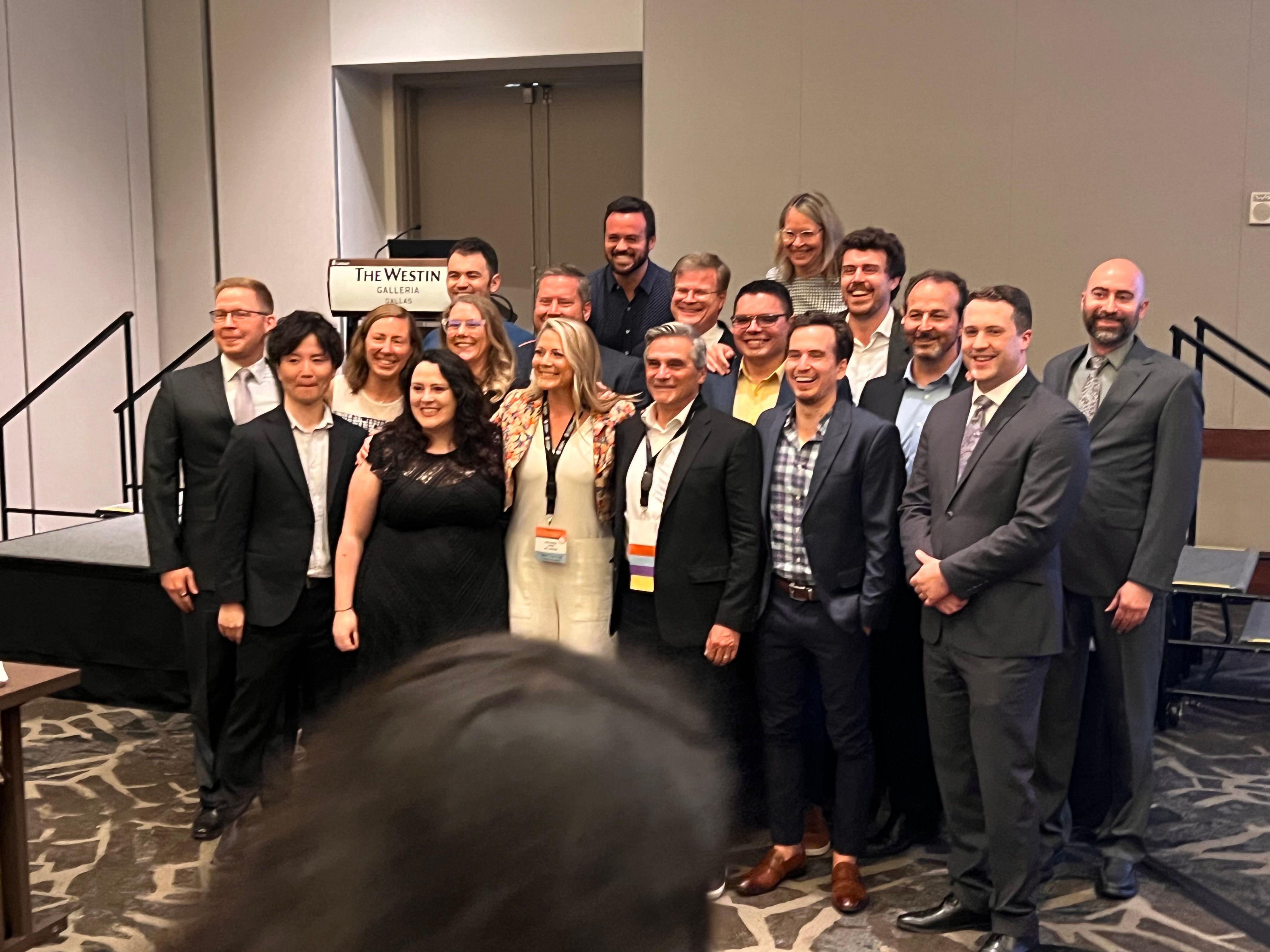 Dr. Elizabeth Hoefer posing with a group of fellow chiropractic diplomate colleagues at a conference at the Westin Galleria Dallas.