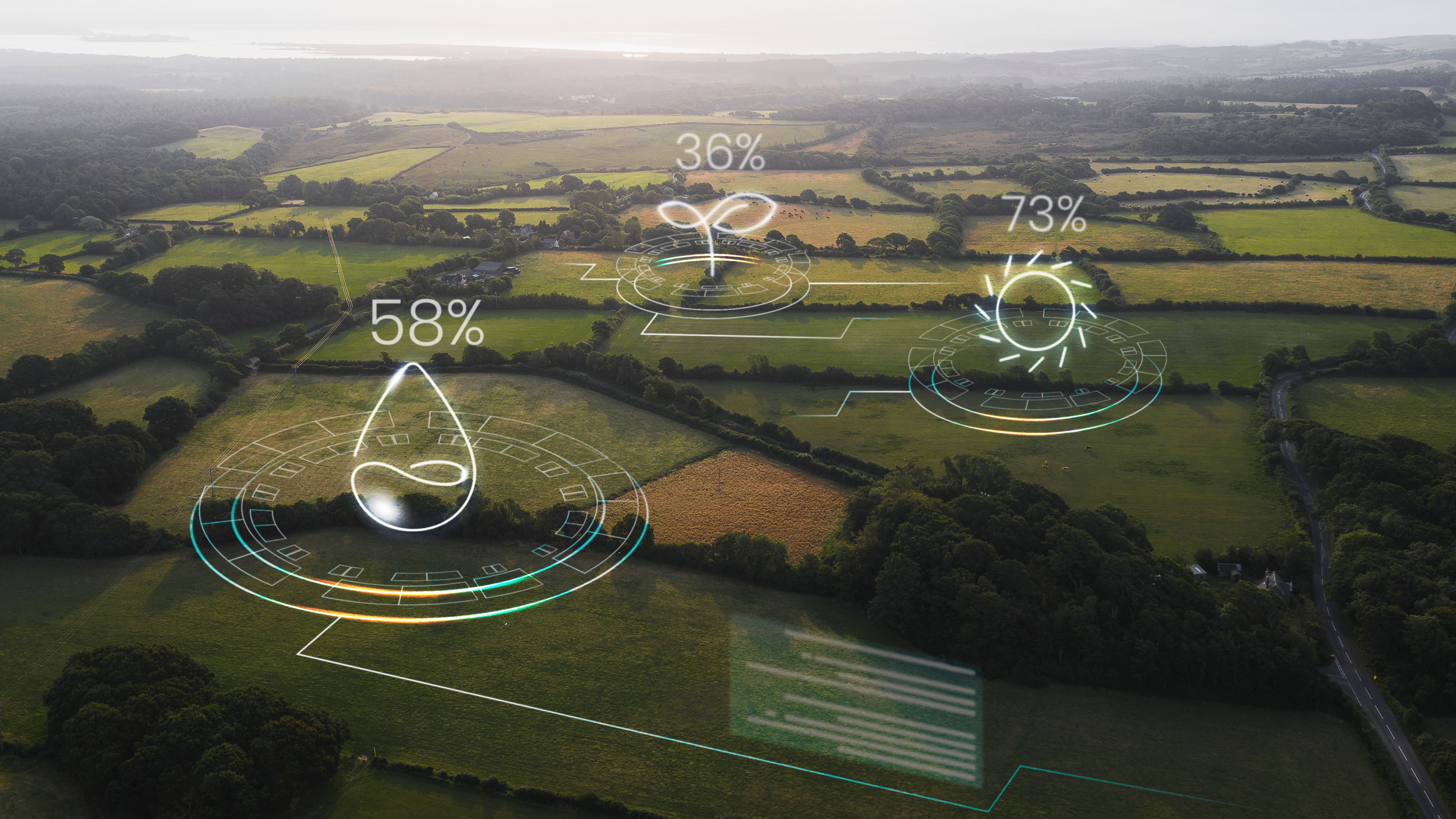 Aerial view of farmland with digital icons and percentage indicators for water, crops and sunlight