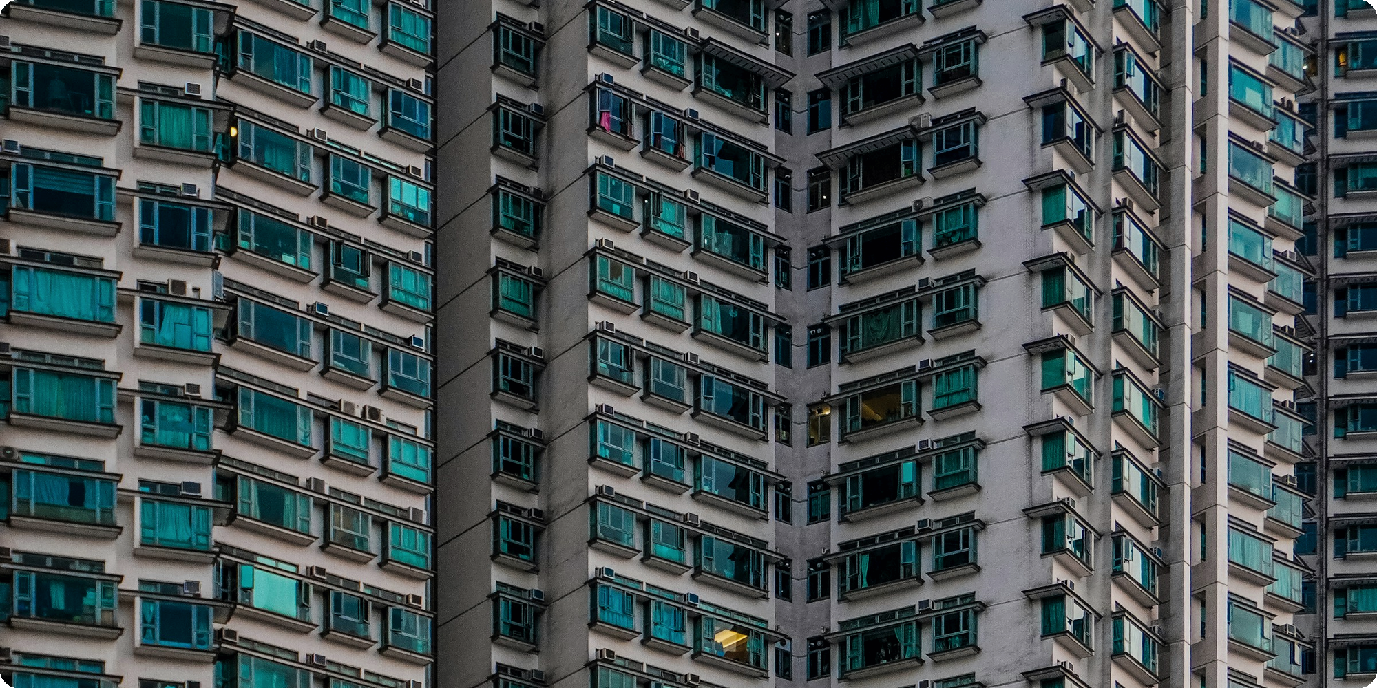 A dense apartment high-rise of near-identical units