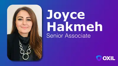 Gemini said An image featuring a professional headshot of Joyce Hakmeh, a Senior Associate at OXIL. On the left side of the image, there is a portrait of Joyce, a woman with long brown hair, wearing a black top and a silver necklace with large circular links. The background of the portrait is white. To the right of the portrait, on a blue and purple gradient background, is the text "Joyce Hakmeh" in large white bold letters, and below it, "Senior Associate" in a smaller white font. In the bottom right corner, there is a logo for OXIL.
